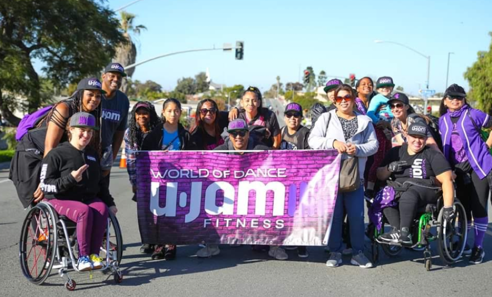 Ania and friends with World of Dance Banner